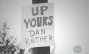 Sign on telephone pole: "Up Yours Dan Rather"