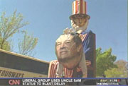 Uncle Sam whacking Tom DeLay figure on head